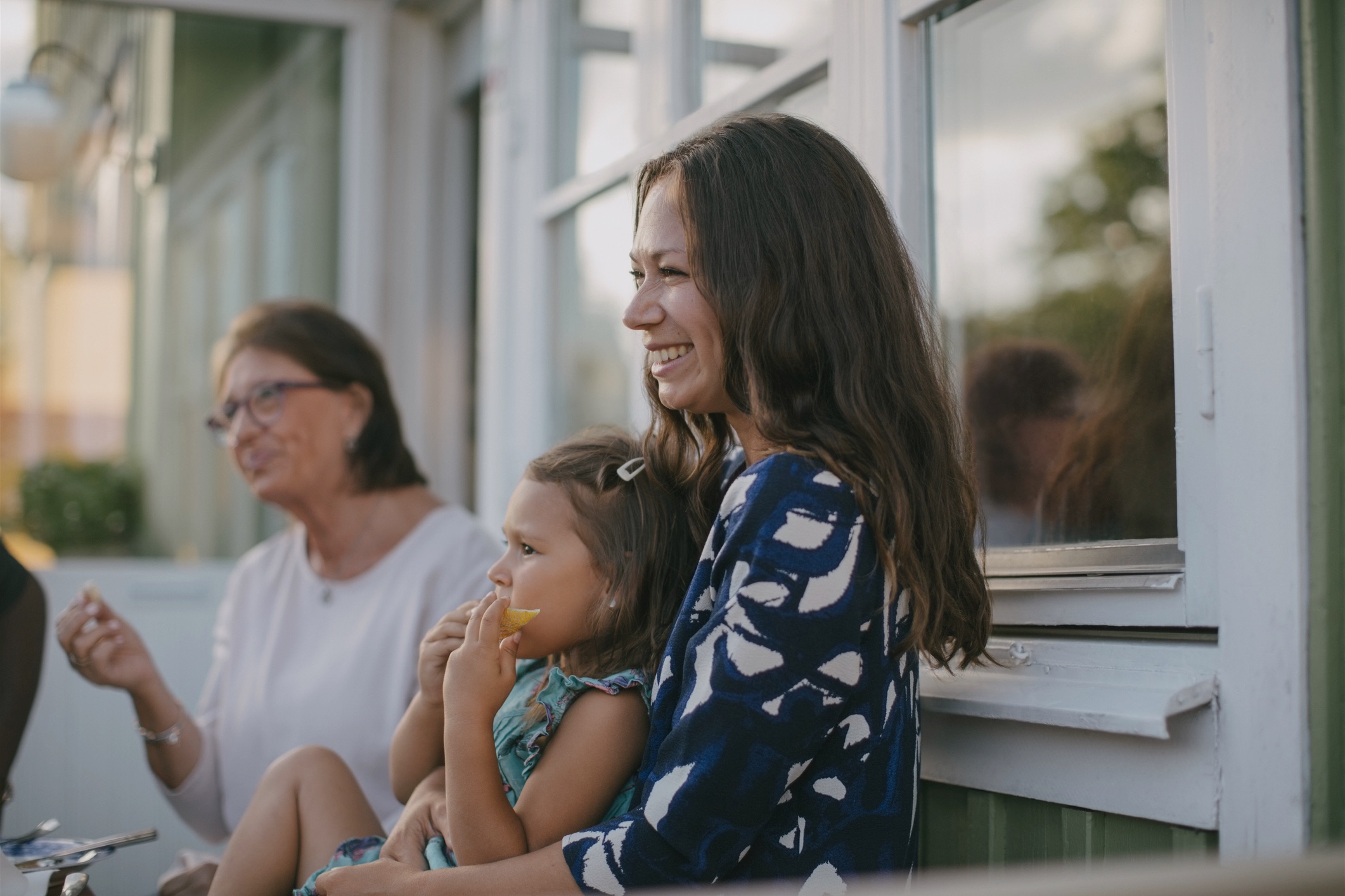 mother smiling with daughter